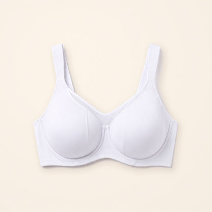 Sostén minimizer blanco con panel de malla, sobre fondo crema