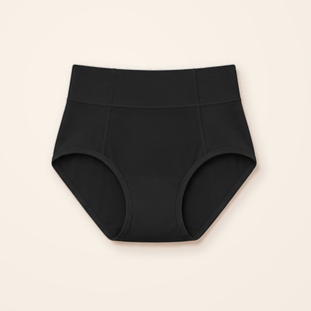 Panty moldeador negro de tiro alto con banda ancha, sobre fondo crema