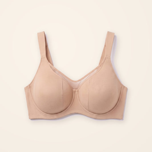 Sostén minimizer beige con panel de malla, sobre fondo crema