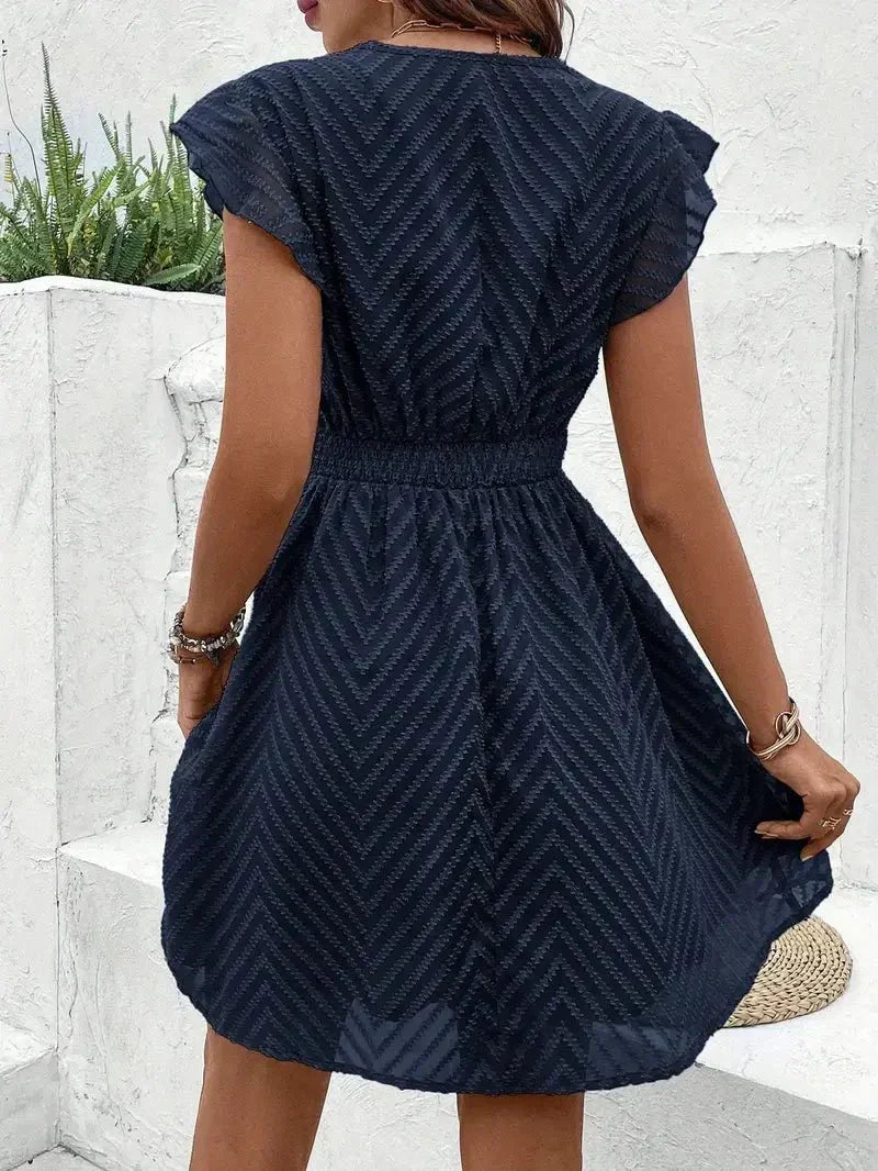 Vestido corto bordado con cintura entallada Selloryta