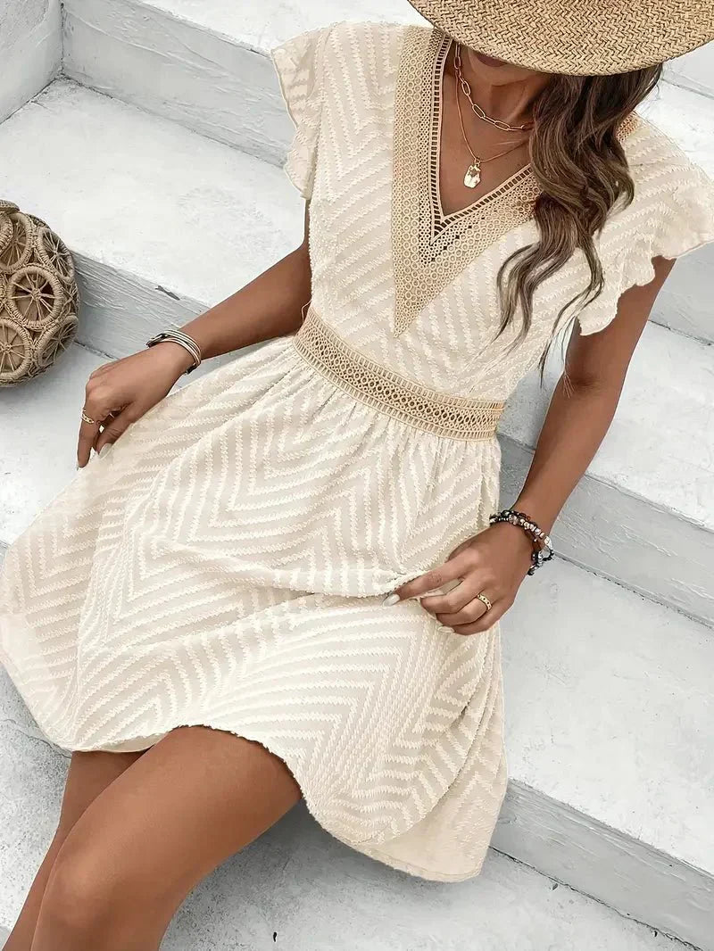Vestido corto bordado con cintura entallada Selloryta